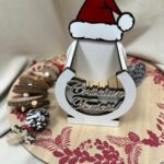 Cutie decorativă cu căciuliță de Moș Crăciun și urare